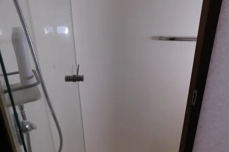  Yacht Photos Pics Shower area in 2009 Tiara Yachts 4300 Sovran, featuring glass door and modern fixtures.