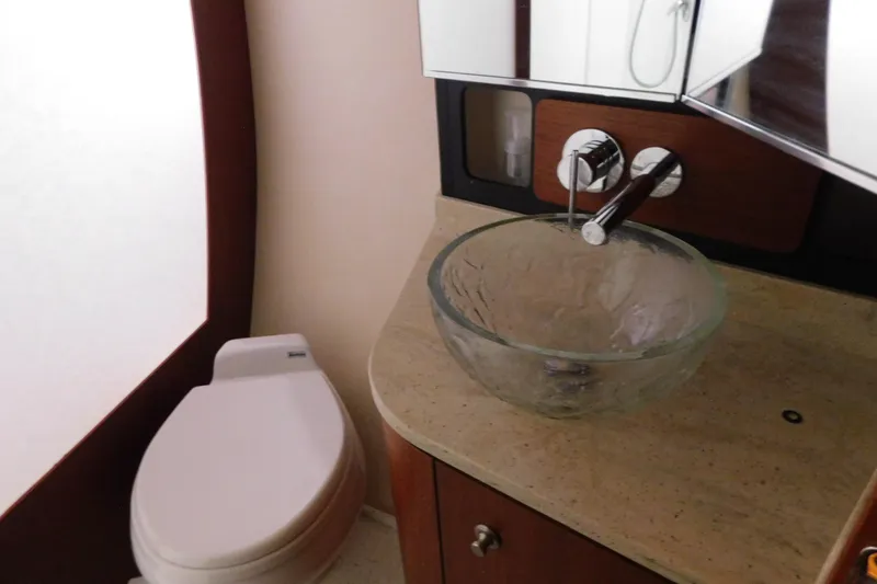 Yacht Photos Pics Luxurious bathroom in 2009 Tiara Yachts 4300 Sovran with glass sink and modern fixtures.