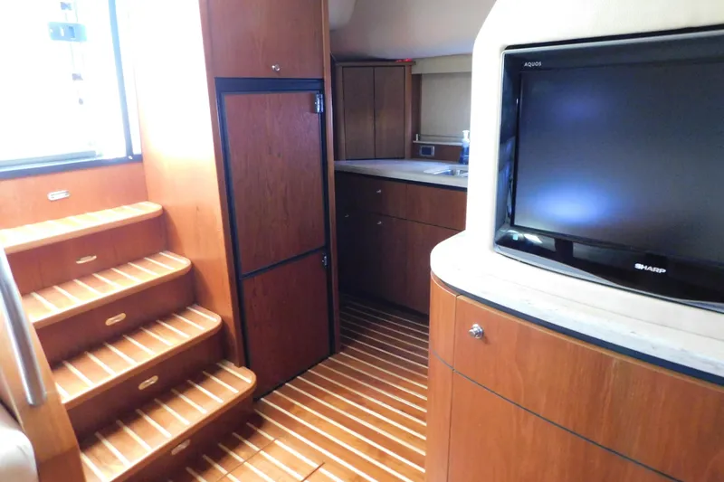  Yacht Photos Pics Interior of 2009 Tiara Yachts 4300 Sovran with wooden stairs and TV.