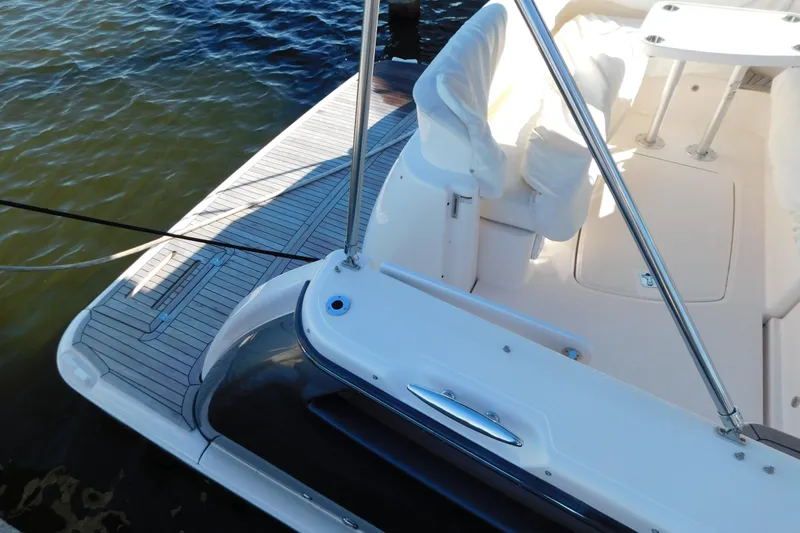  Yacht Photos Pics 2009 Tiara Yachts 4300 Sovran deck with seating and railing, docked on calm water.