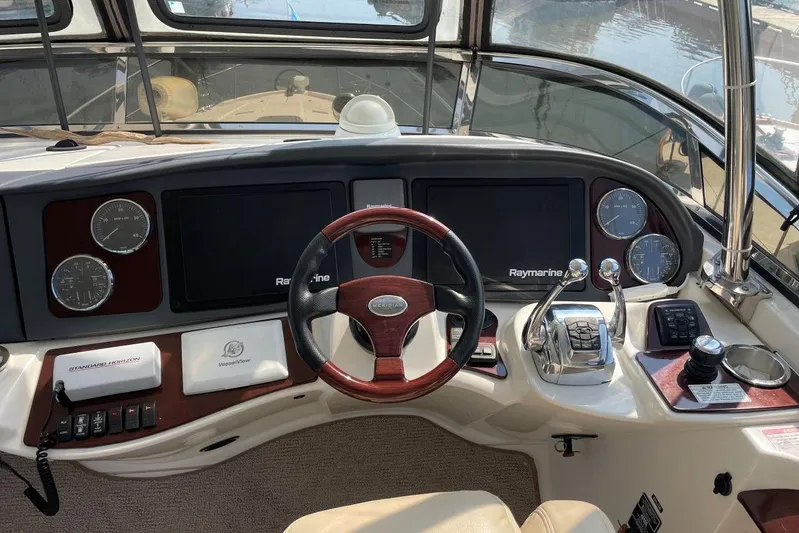  Yacht Photos Pics 2013 Meridian 441 Sedan Upper Helm with Raymarine MFD's, Auto Pilot, Engine Controls, Well Appointed