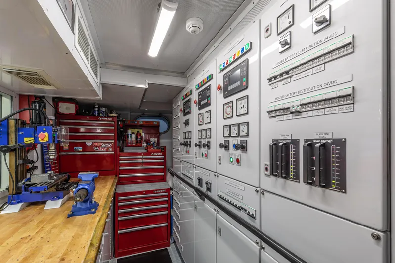 Rena Yacht Photos Pics Electrical control room with tool cabinets and workbench on a 1989 NQEA Motor Yacht.