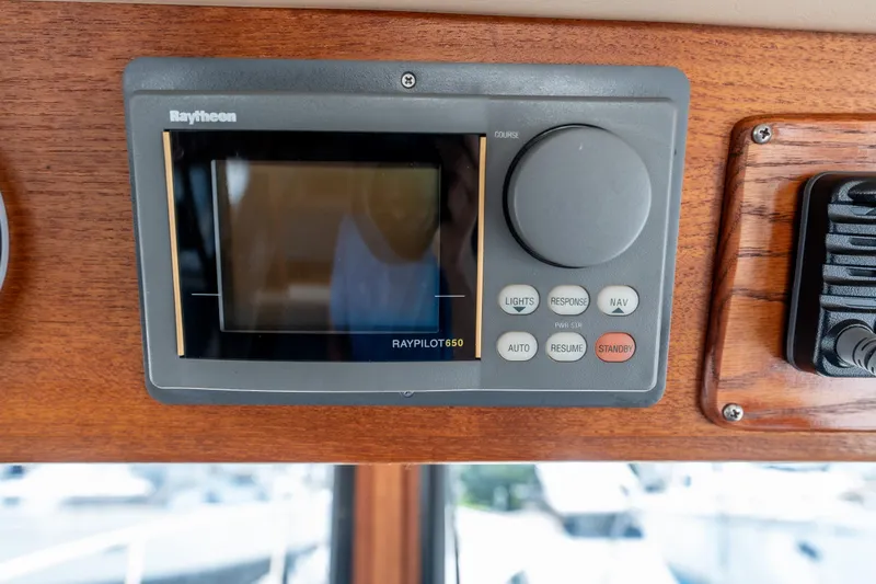 Cinnamon Girl Yacht Photos Pics Raytheon Raypilot 650 control panel on 2000 Nordic Tug 32 boat dashboard.