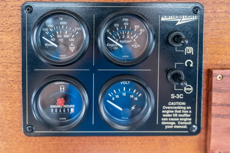 Cinnamon Girl Yacht Photos Pics Instrument panel of a 2000 Nordic Tug 32 with gauges and switches.