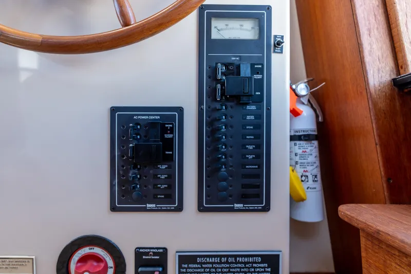 Cinnamon Girl Yacht Photos Pics Control panel of a 2000 Nordic Tug 32 boat with fire extinguisher.