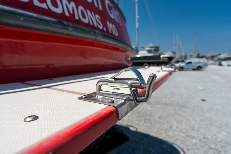 Cinnamon Girl Yacht Photos Pics Close-up of a 2000 Nordic Tug 32 boat cleat on a sunny day.