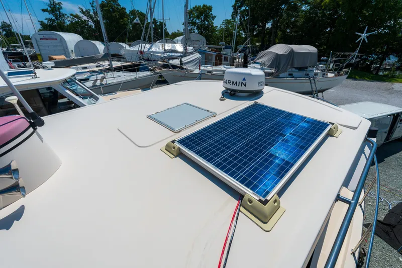 Cinnamon Girl Yacht Photos Pics Nordic Tug 32 (2000) with solar panel and Garmin radar on deck.