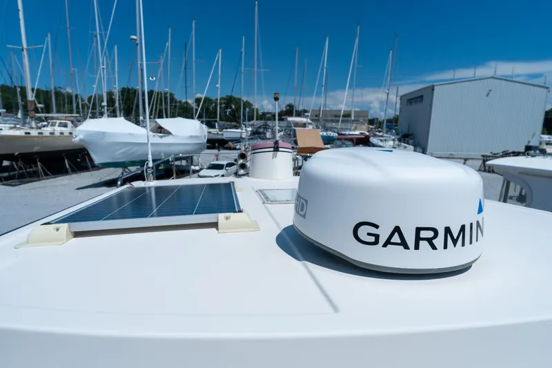 Cinnamon Girl Yacht Photos Pics Nordic Tug 32 boat with Garmin radar and solar panel, docked in a marina, 2000 model.