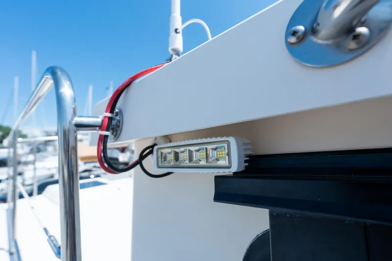 Cinnamon Girl Yacht Photos Pics Close-up of a 2000 Nordic Tug 32 boat's LED light and railing.