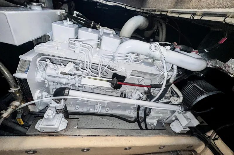 Cinnamon Girl Yacht Photos Pics Engine compartment of a 2000 Nordic Tug 32, showcasing detailed mechanical components.