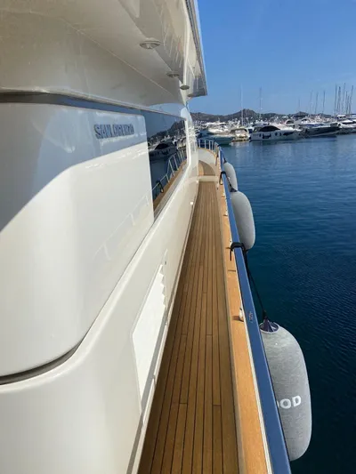  Yacht Photos Pics Sanlorenzo SL82 yacht, 2010 model, docked with wooden deck and marina view.