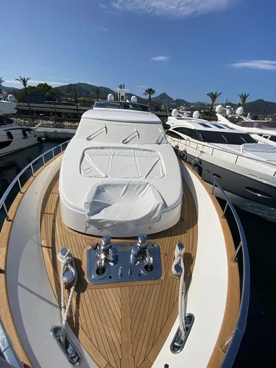  Yacht Photos Pics Sanlorenzo SL82 2010 yacht with sleek deck design, docked in a marina.