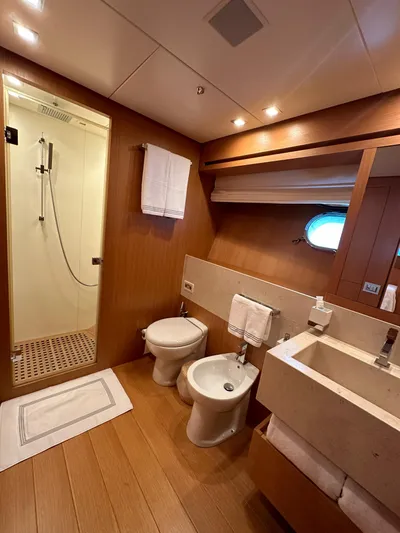  Yacht Photos Pics Luxurious bathroom in 2010 Sanlorenzo SL82 yacht with shower, sink, and bidet.