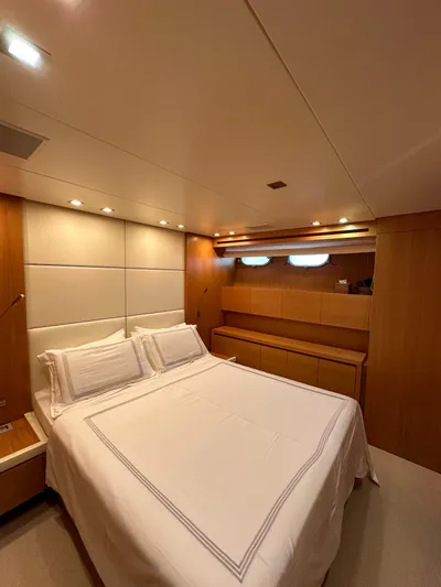  Yacht Photos Pics Luxurious bedroom interior of 2010 Sanlorenzo SL82 yacht with elegant wood paneling.