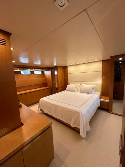  Yacht Photos Pics Luxurious bedroom interior of 2010 Sanlorenzo SL82 yacht with modern design and cozy ambiance.