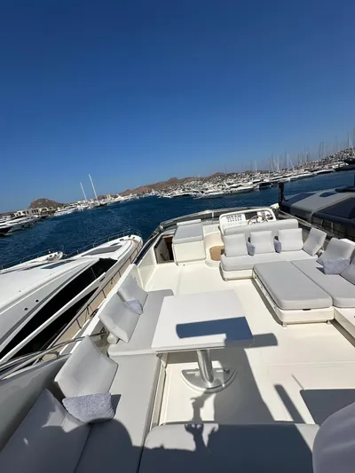  Yacht Photos Pics Luxurious 2010 Sanlorenzo SL82 yacht with spacious deck and seating, docked in a marina.