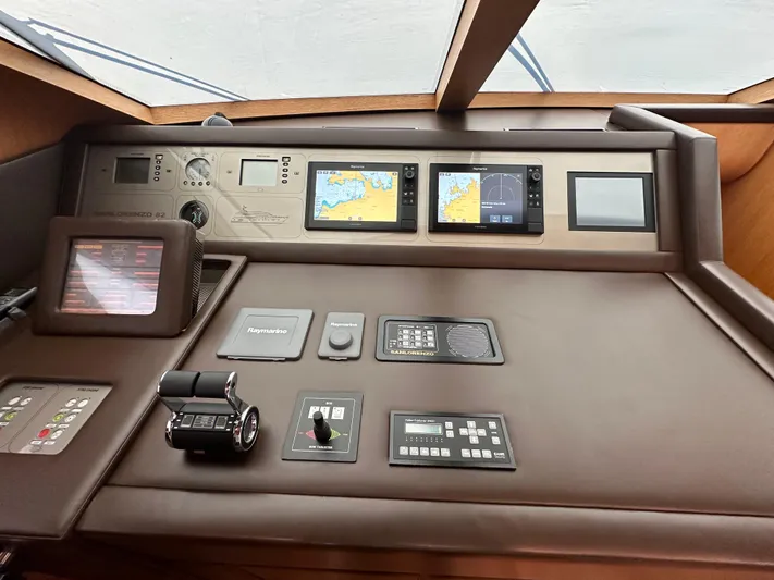  Yacht Photos Pics Control panel of 2010 Sanlorenzo SL82 yacht with navigation screens and instruments.