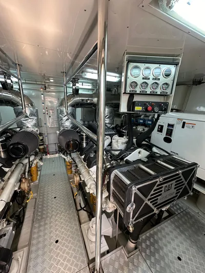  Yacht Photos Pics Engine room of 2010 Sanlorenzo SL82 yacht with CAT machinery and control panel.