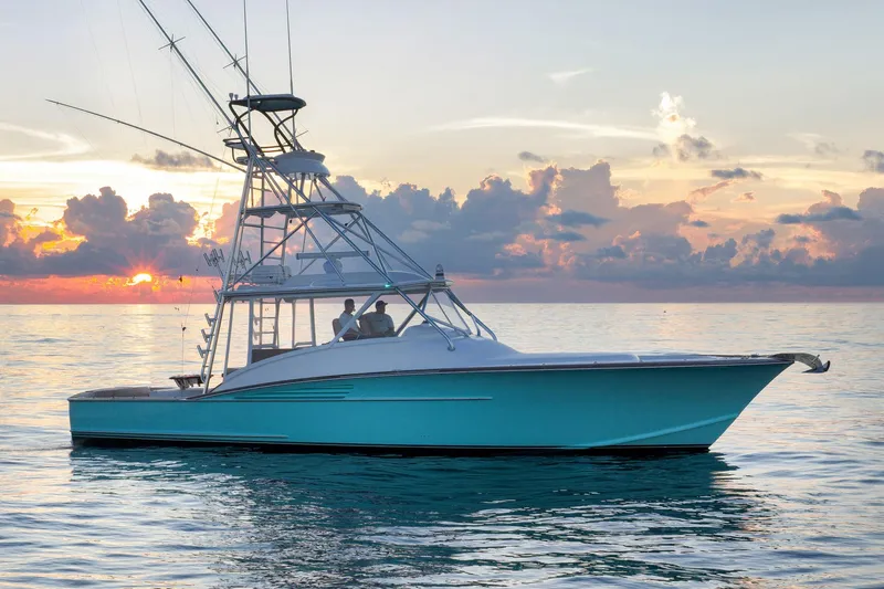 Karma Yacht Photos Pics 2019 Winter Custom Yachts 46 Walkaround at sunset on calm ocean waters.