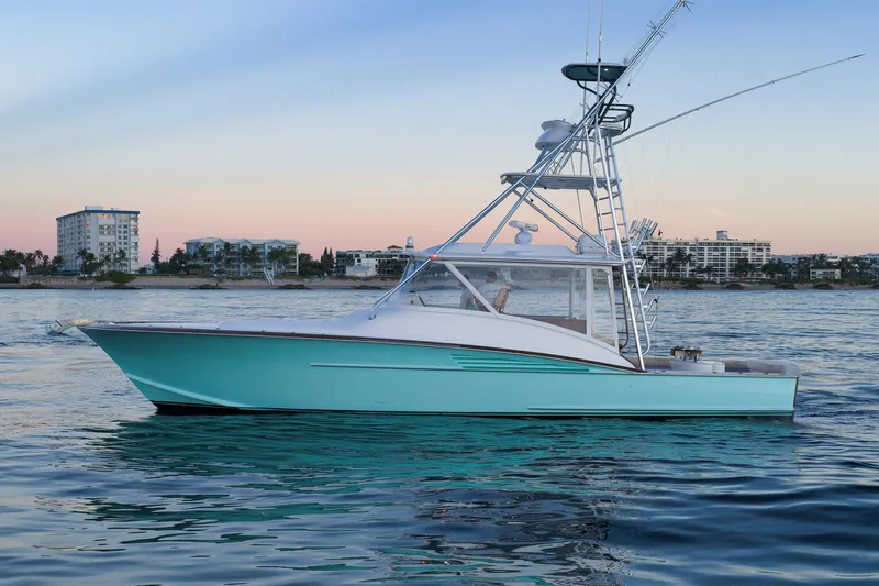 Karma Yacht Photos Pics 2019 Winter Custom Yachts 46 Walkaround on calm water at sunset.