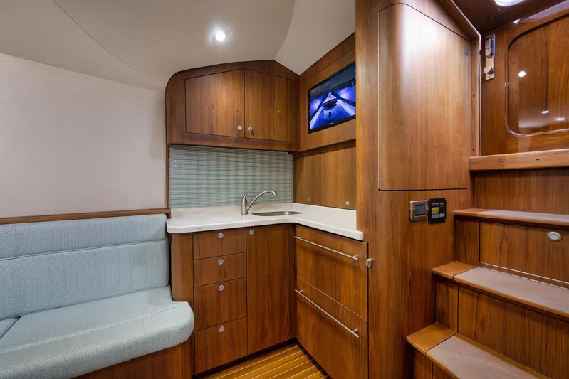 Karma Yacht Photos Pics Luxurious interior of 2019 Winter Custom Yachts 46 Walkaround with wood finish and modern amenities.