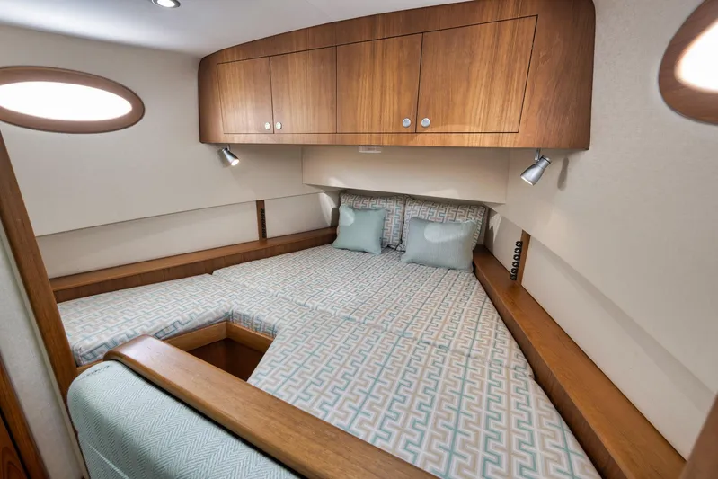 Karma Yacht Photos Pics Luxurious cabin interior of 2019 Winter Custom Yachts 46 Walkaround, featuring elegant wood finishes.