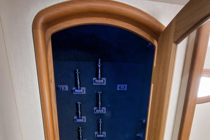 Karma Yacht Photos Pics Interior view of 2019 Winter Custom Yachts 46 Walkaround, featuring wooden cabinetry and storage hooks.