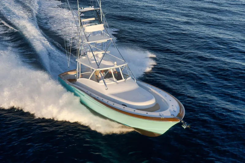 Karma Yacht Photos Pics 2019 Winter Custom Yachts 46 Walkaround cruising on open water, showcasing sleek design and performance.