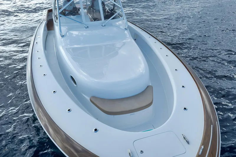 Karma Yacht Photos Pics 2019 Winter Custom Yachts 46 Walkaround on calm water, showcasing sleek design and spacious deck.