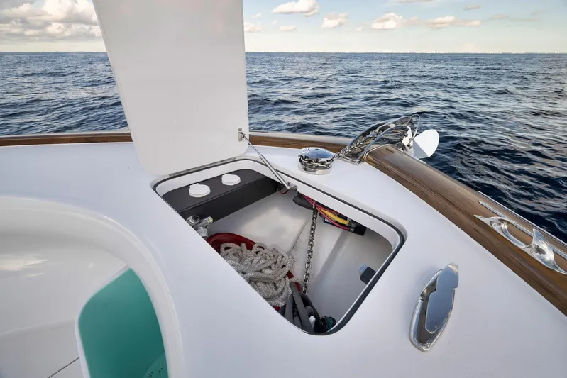 Karma Yacht Photos Pics 2019 Winter Custom Yachts 46 Walkaround, open hatch with ropes and chain, ocean backdrop.