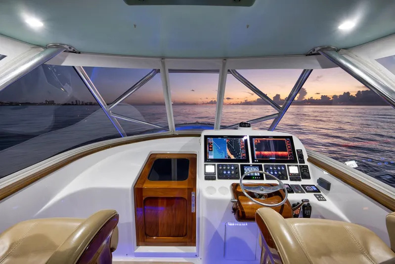 Karma Yacht Photos Pics 2019 Winter Custom Yachts 46 Walkaround helm with sunset ocean view, featuring advanced navigation systems.