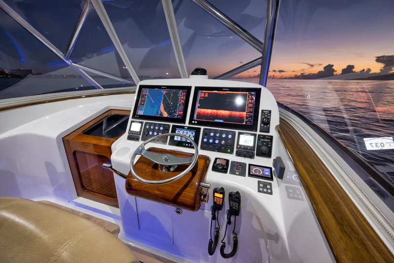 Karma Yacht Photos Pics 2019 Winter Custom Yachts 46 Walkaround helm with advanced navigation systems at sunset.