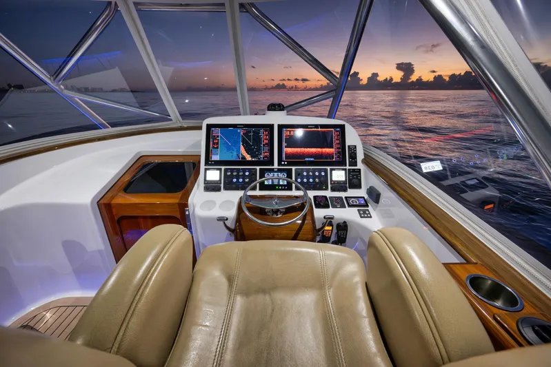 Karma Yacht Photos Pics Helm of 2019 Winter Custom Yachts 46 Walkaround at sunset, featuring advanced navigation systems.