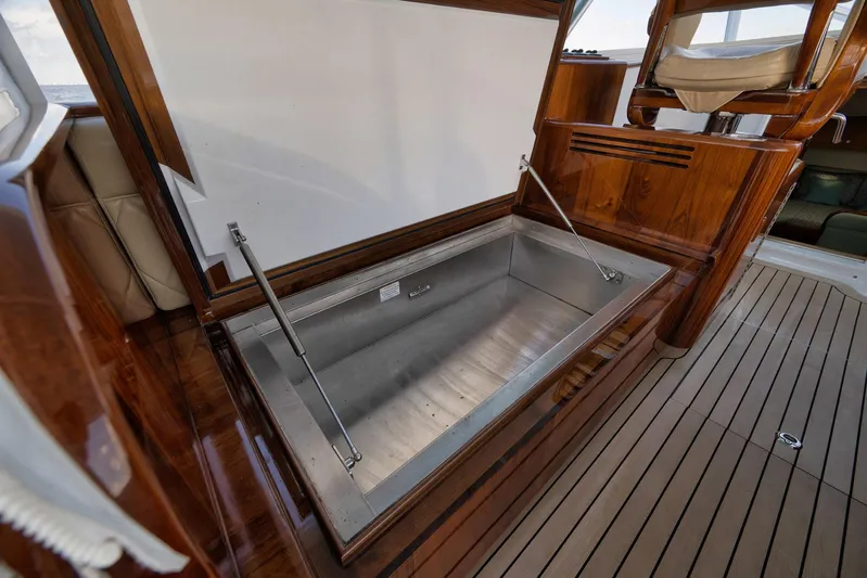 Karma Yacht Photos Pics 2019 Winter Custom Yachts 46 Walkaround with open storage compartment on deck.