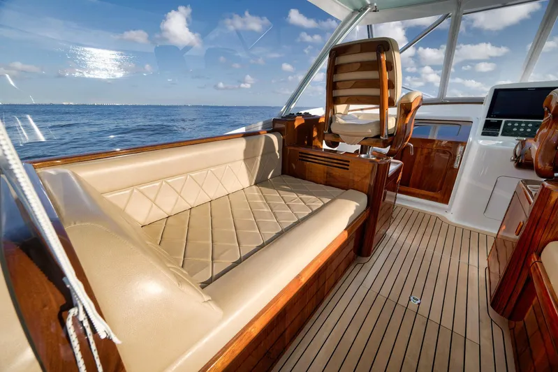 Karma Yacht Photos Pics Luxurious interior of 2019 Winter Custom Yachts 46 Walkaround, featuring elegant seating and wood finishes.