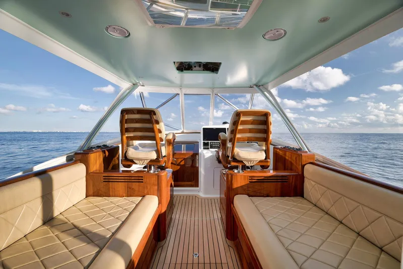 Karma Yacht Photos Pics Luxurious interior of 2019 Winter Custom Yachts 46 Walkaround, featuring elegant seating and ocean view.