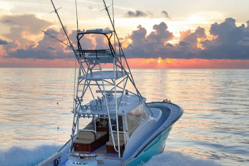 Karma Yacht Photos Pics 2019 Winter Custom Yachts 46 Walkaround at sunset on calm ocean waters.