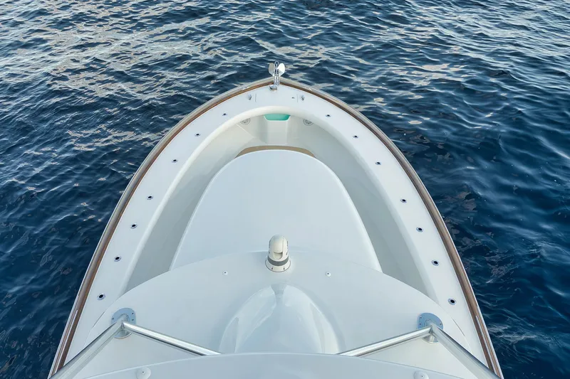 Karma Yacht Photos Pics Bow view of 2019 Winter Custom Yachts 46 Walkaround on calm blue water.