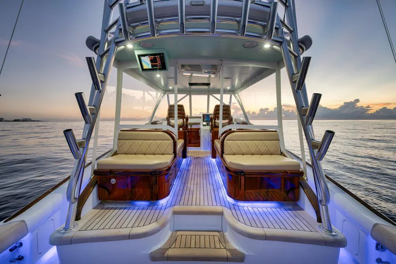 Karma Yacht Photos Pics Luxurious 2019 Winter Custom Yachts 46 Walkaround at sunset, featuring elegant seating and ambient lighting.