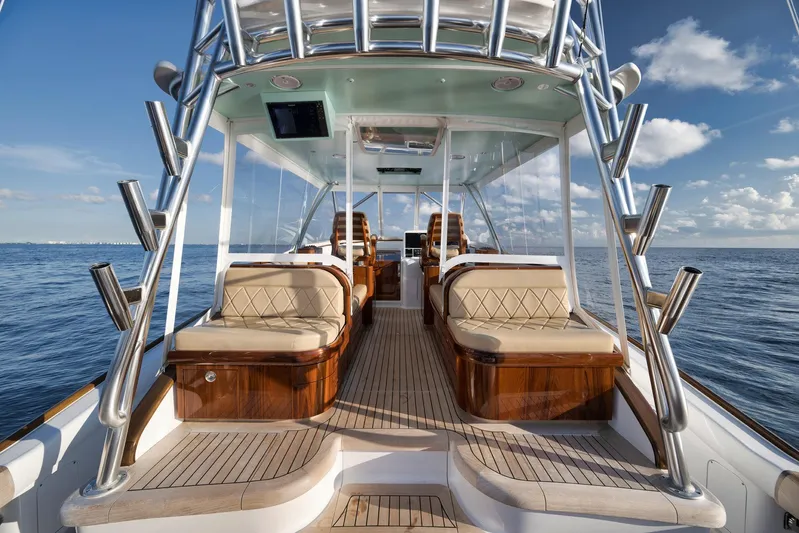 Karma Yacht Photos Pics Luxurious 2019 Winter Custom Yachts 46 Walkaround on open sea, featuring elegant seating and sleek design.