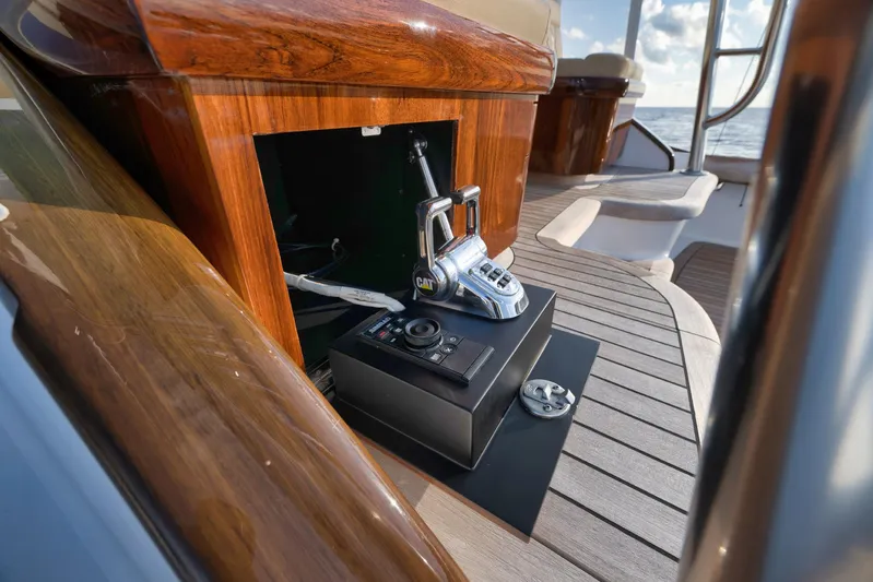 Karma Yacht Photos Pics 2019 Winter Custom Yachts 46 Walkaround helm controls on teak deck, showcasing luxury craftsmanship.