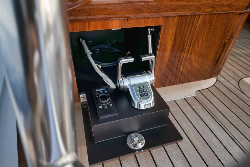 Karma Yacht Photos Pics Control panel of 2019 Winter Custom Yachts 46 Walkaround, featuring polished wood and modern controls.