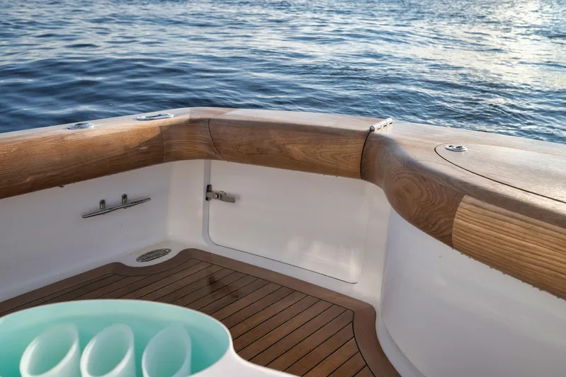 Karma Yacht Photos Pics 2019 Winter Custom Yachts 46 Walkaround, teak deck detail, overlooking calm ocean waters.