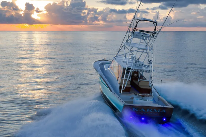 Karma Yacht Photos Pics 2019 Winter Custom Yachts 46 Walkaround cruising at sunset on calm ocean waters.