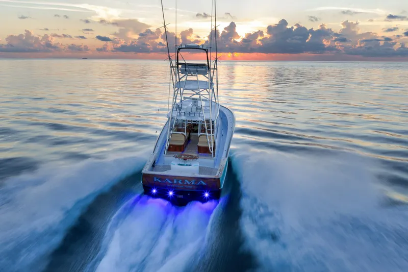 Karma Yacht Photos Pics 2019 Winter Custom Yachts 46 Walkaround cruising at sunset with vibrant ocean backdrop.