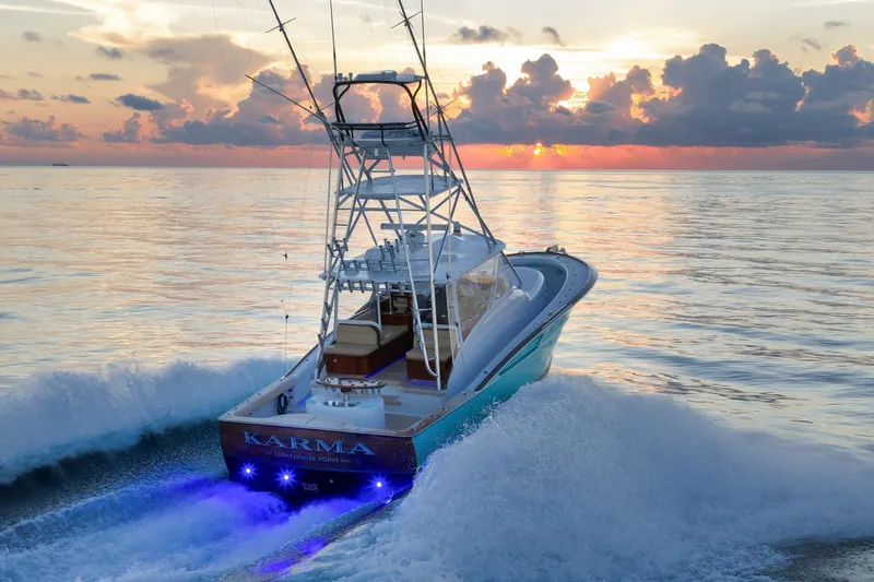 Karma Yacht Photos Pics 2019 Winter Custom Yachts 46 Walkaround cruising at sunset with vibrant ocean waves.