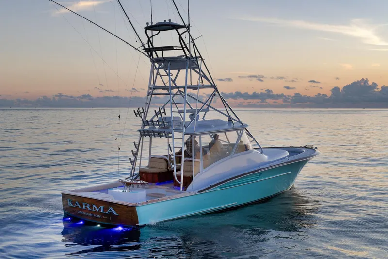 Karma Yacht Photos Pics 2019 Winter Custom Yachts 46 Walkaround at sunset on calm ocean waters.