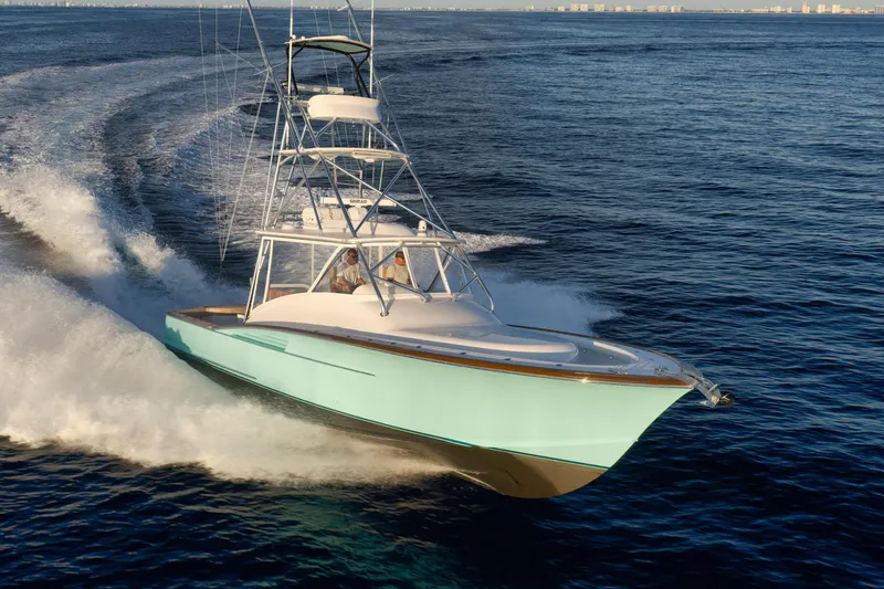 Karma Yacht Photos Pics 2019 Winter Custom Yachts 46 Walkaround cruising on open water, showcasing sleek design.