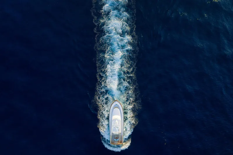 Karma Yacht Photos Pics Aerial view of 2019 Winter Custom Yachts 46 Walkaround cruising on deep blue ocean.