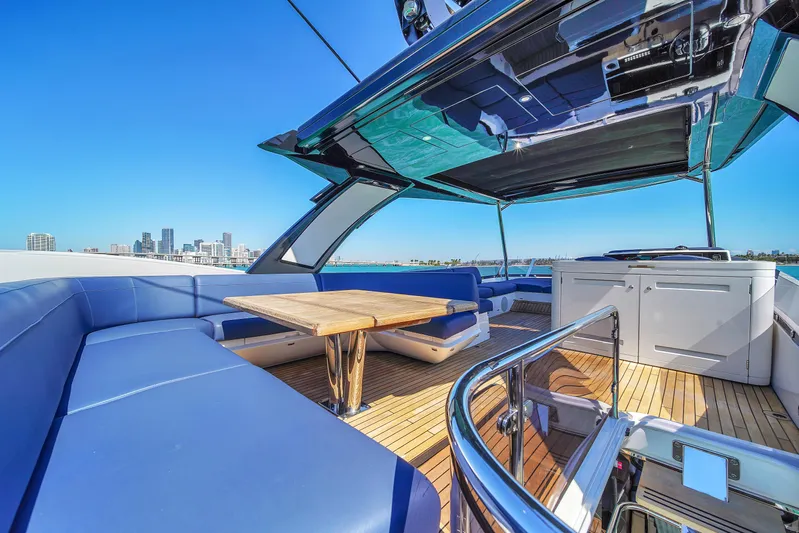 Atkun Yacht Photos Pics Luxurious 2021 Sunseeker 68 Manhattan yacht with spacious outdoor seating and dining area.